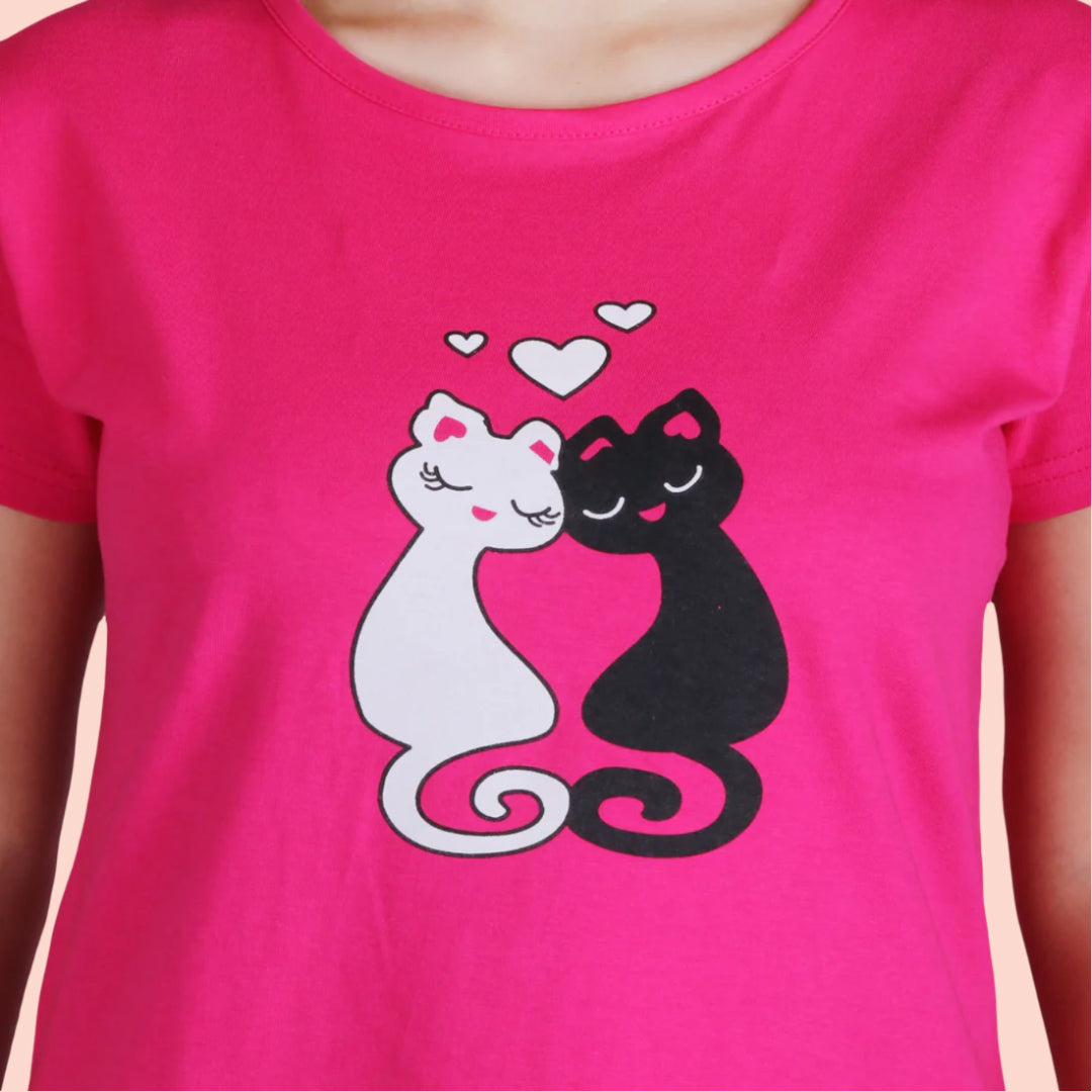 closeup view of cotton pink color short nighty with chest print, two cats one in white color and another in black color