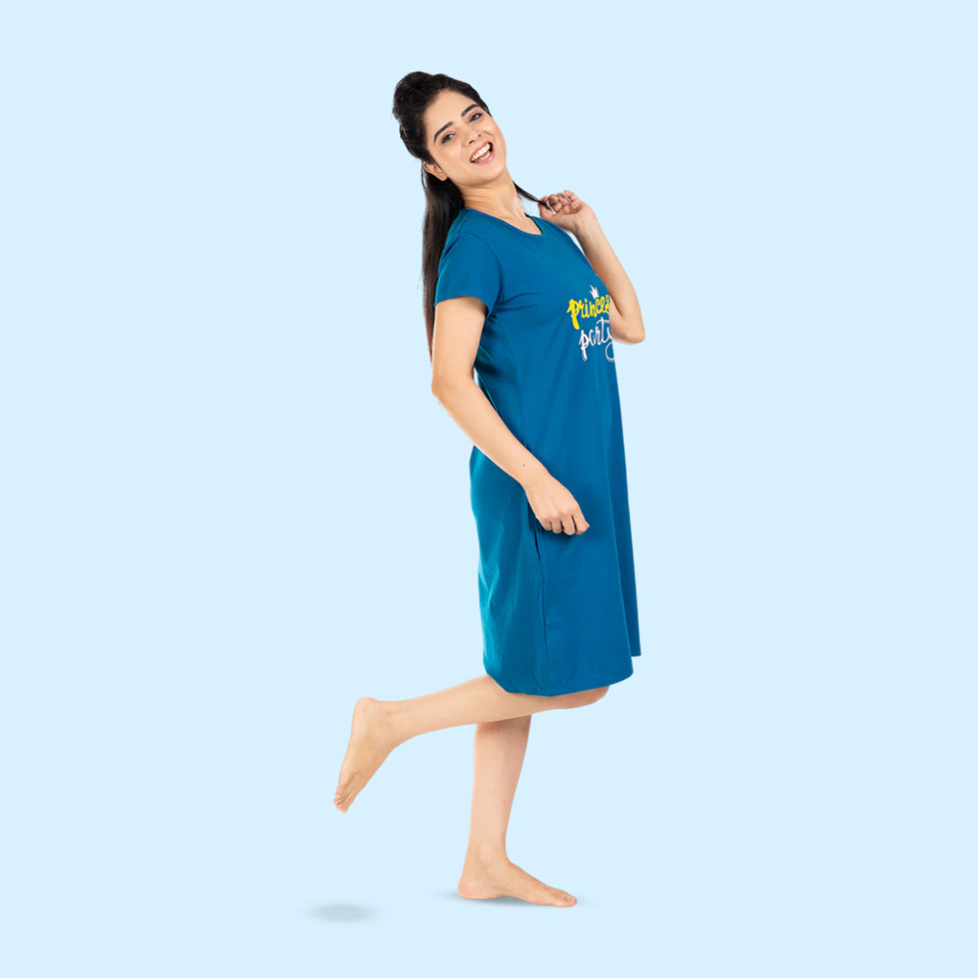 side view of teal blue color cotton short nighty with princess party written on the chest area in white and yellow color