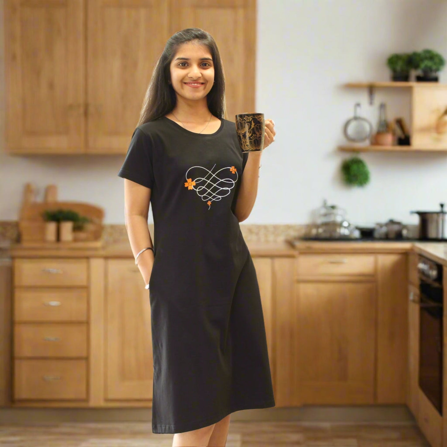 women wearing knee length nighty and posing casually holding a coffee mug