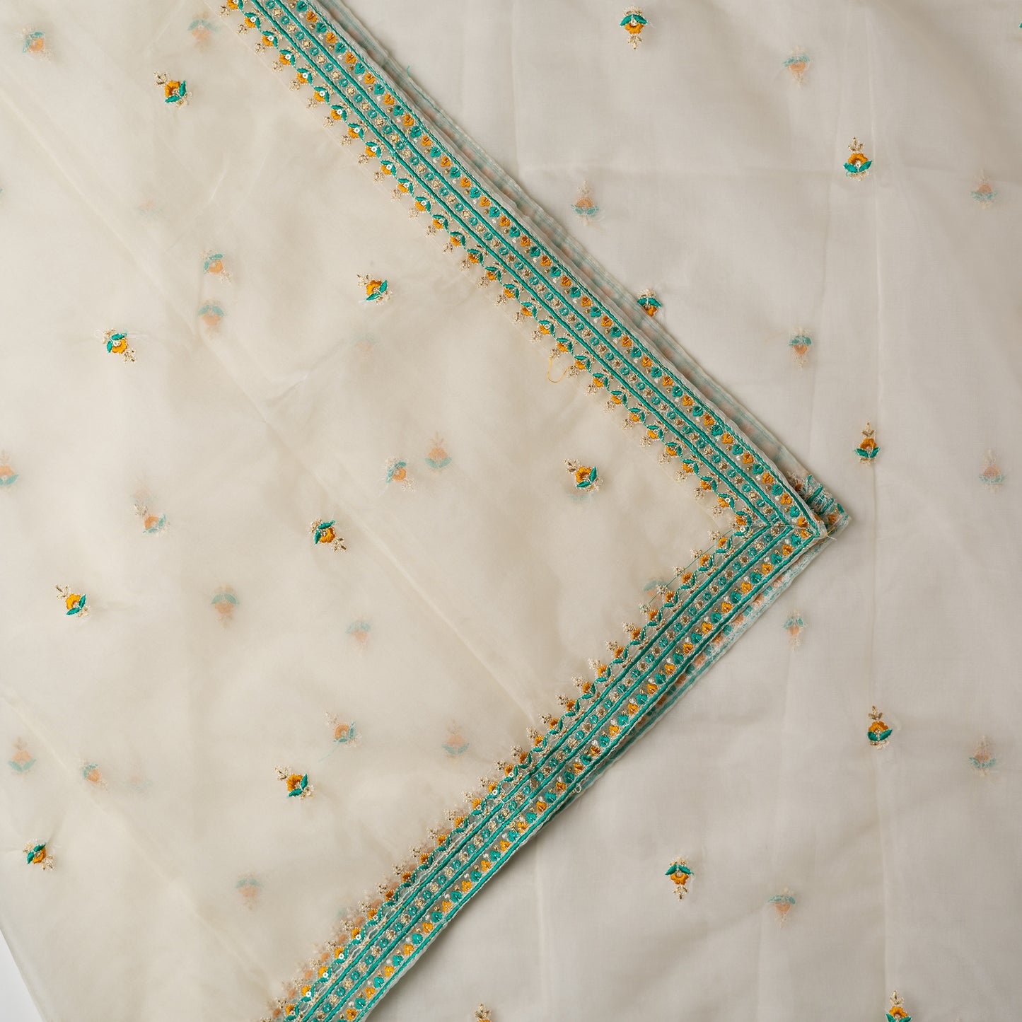 Matching cream color dupatta with embroidery work all over and on the borders.