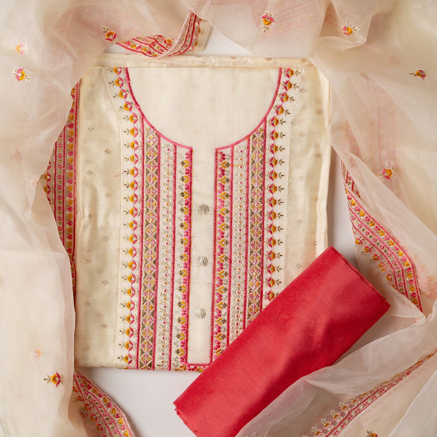 A unique design , perfect for your loved ones . Gift this beautifully embroidered chanderi silk unstitched salwar suit material. Top with embroidery work on neck line and golden thread jacquard small design weaving all over. The border of the dress is also embroidered elegantly. Matching cream color dupatta with embroidery work all over and on the borders. Peach color cotton silk bottom.