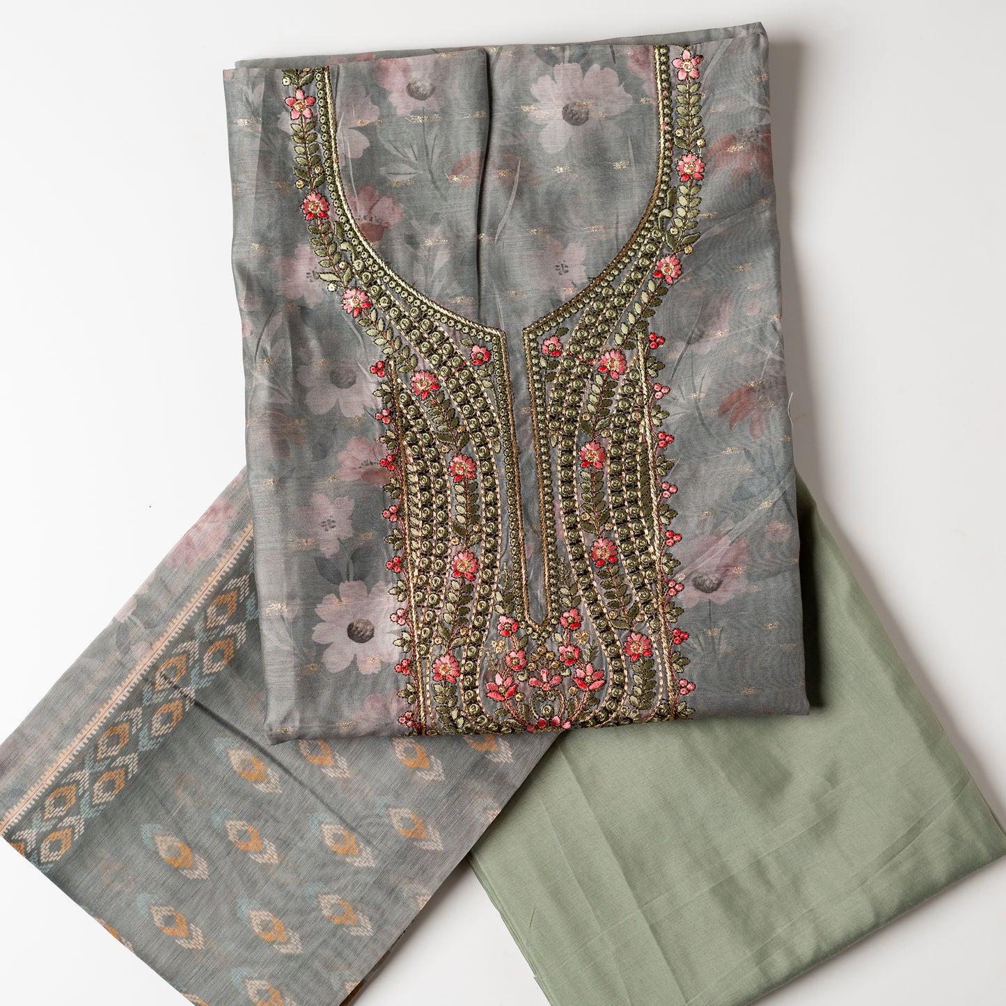 It's just awesome, pick any color of this design and we are sure you will love it the most. Beautiful embroidery work in the neck. Sober floral prints and jacquard weaving in golden thread is giving the set a royal look. Silk dupatta with exact same design as the top with golden color border. Pastel green color bottom matching exactly as the top and dupatta.