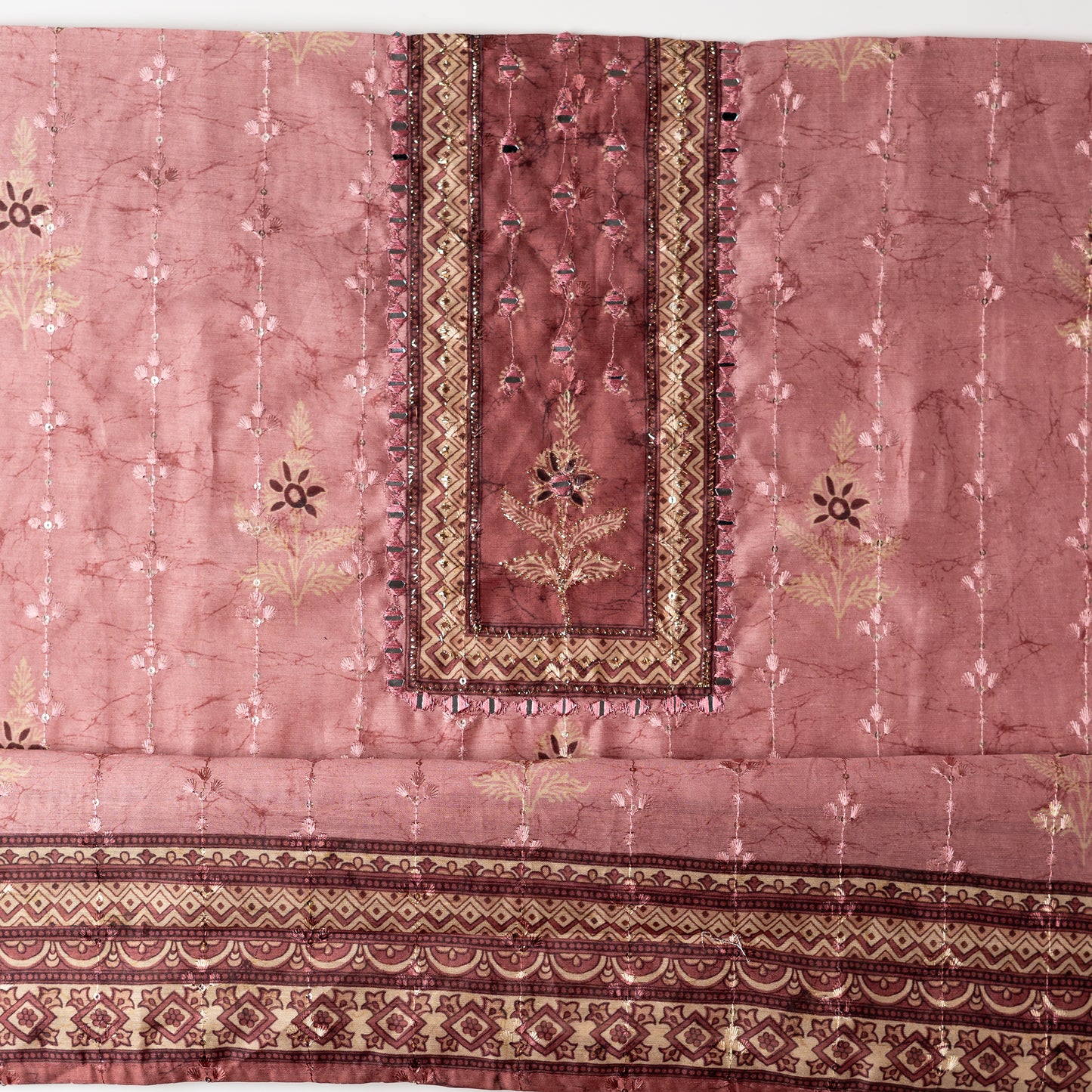 Chanderi silk dress material with print design, embroidery work, thread work and sequins work. It has zari and mirror work in neck area also.