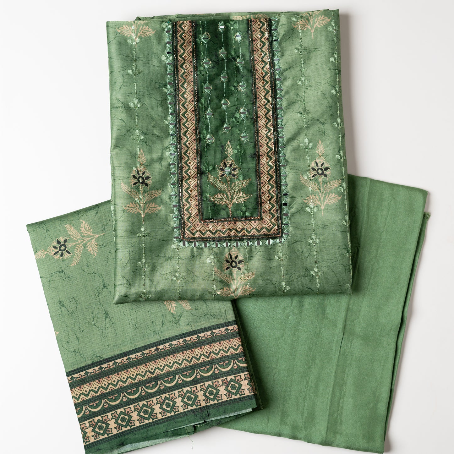 Chanderi silk dress material with print design, embroidery work, thread work and sequins work. It has zari and mirror work in neck area also. Silk dupatta with beautiful digital prints matching the top color. Cotton silk bottom same green color as the top and dupatta.