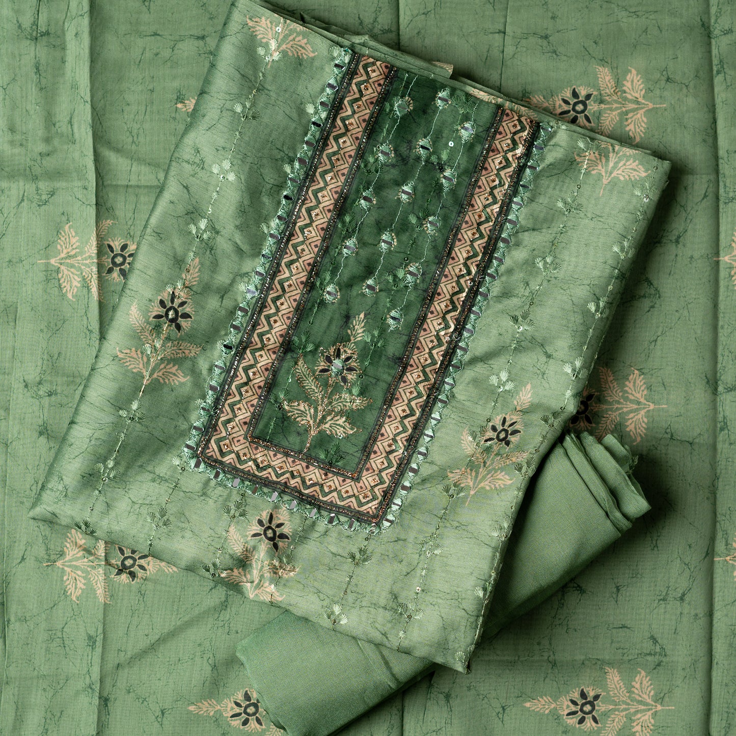 Chanderi silk dress material with print design, embroidery work, thread work and sequins work. It has zari and mirror work in neck area also. Silk dupatta with beautiful digital prints matching the top color. Cotton silk bottom same green color as the top and dupatta.