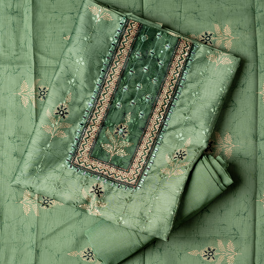 Chanderi silk dress material with print design, embroidery work, thread work and sequins work. It has zari and mirror work in neck area also. Silk dupatta with beautiful digital prints matching the top color. Cotton silk bottom same green color as the top and dupatta.