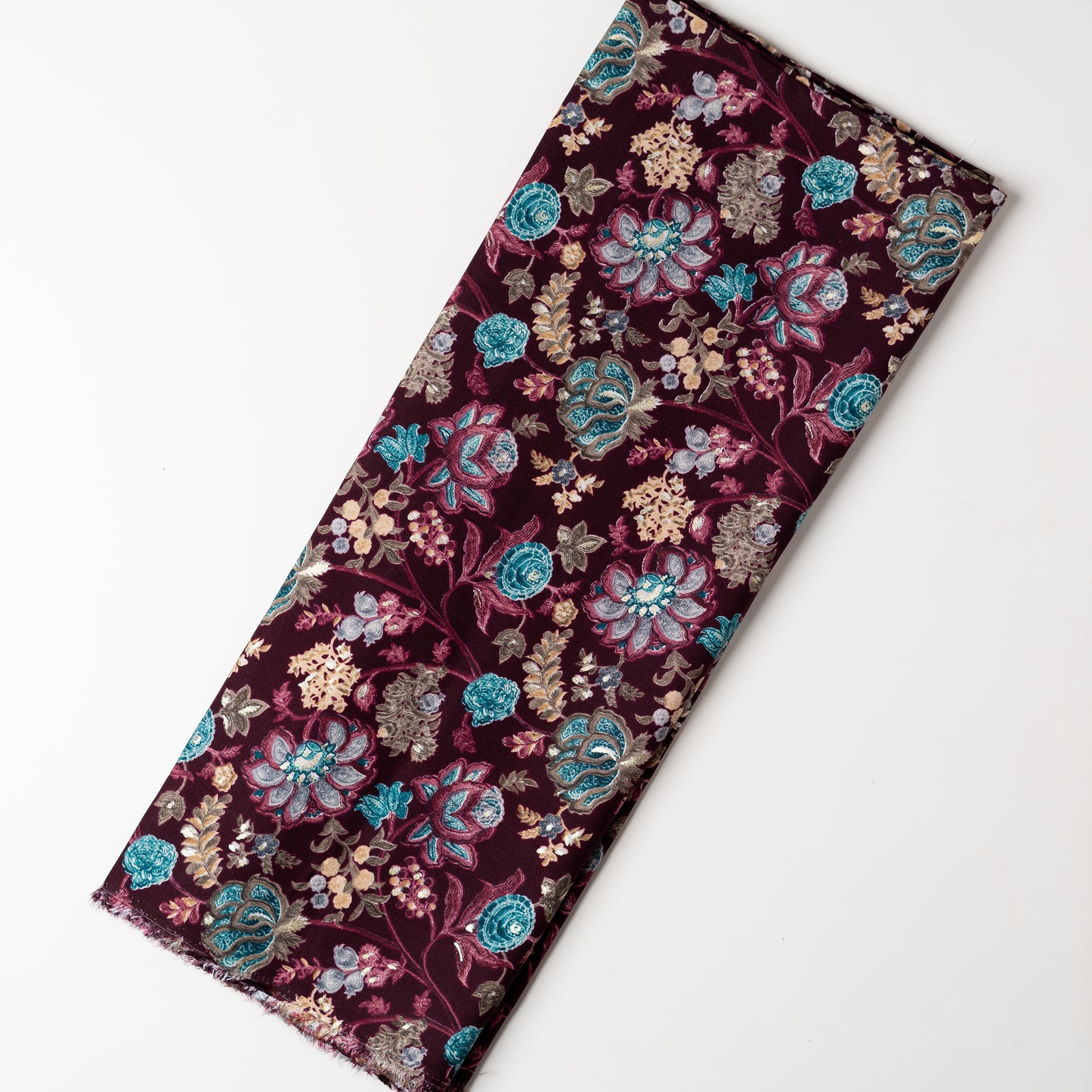 wine red color rayon fabric with gold color print design along with other multi color floral designs