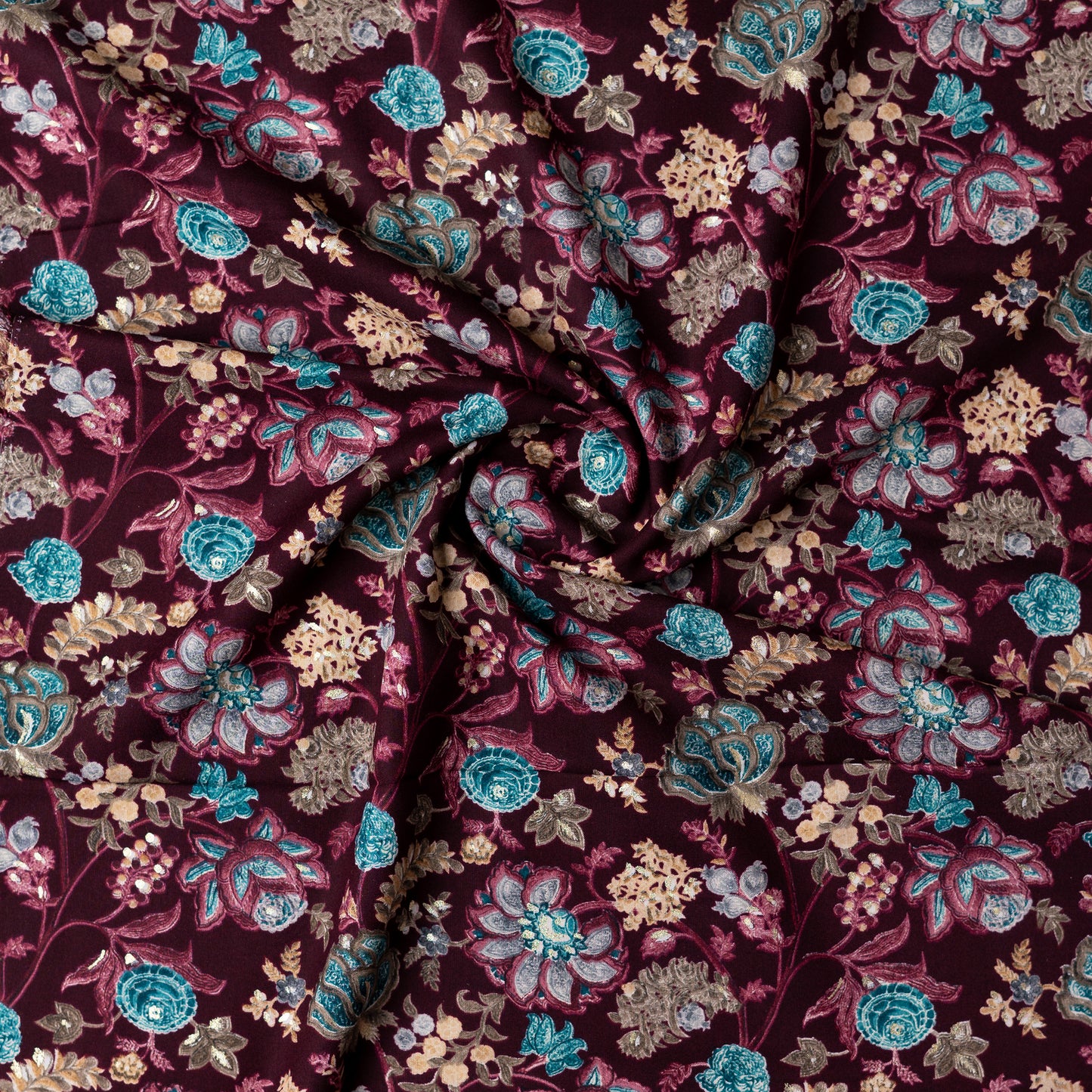 wine red color rayon fabric with gold color print design along with other multi color floral designs