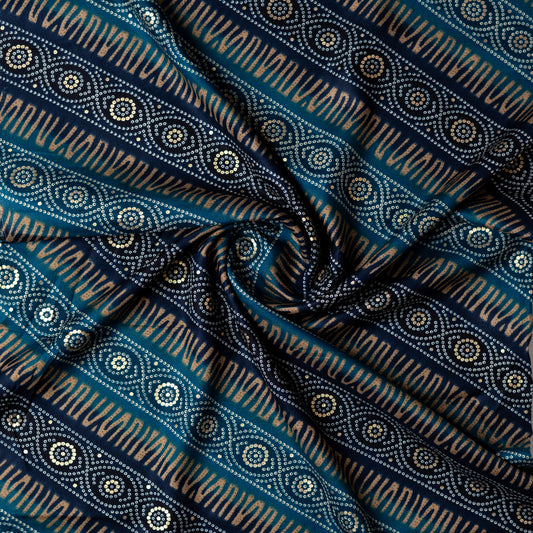 blue color rayon fabric with gold color print design