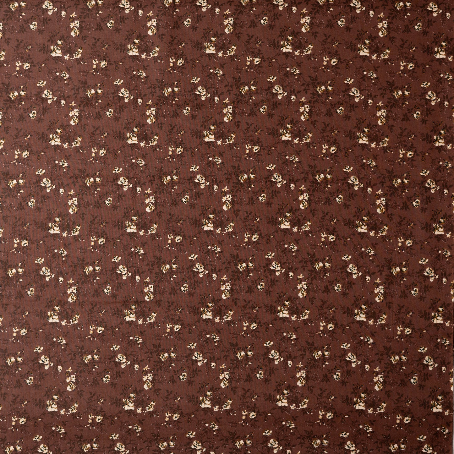Brown color cotton printed running fabrics with cream color floral prints