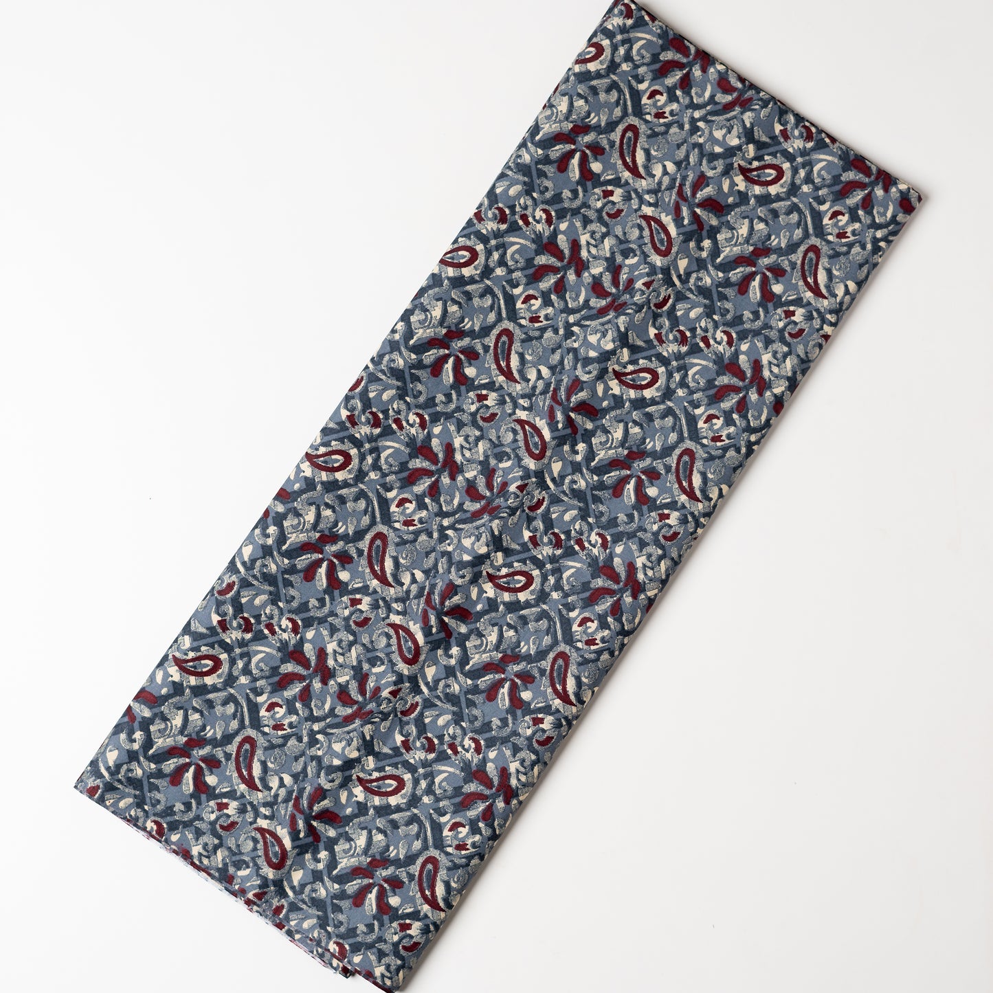 Grey color fabric with dark maroon and cream color prints