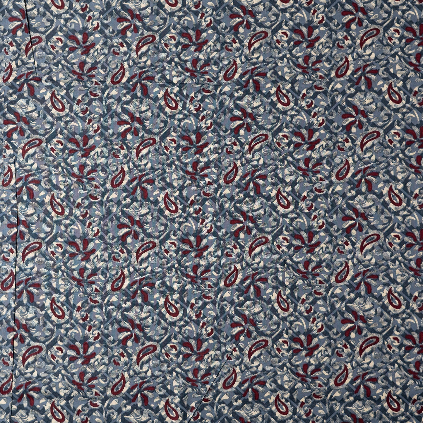 Grey color fabric with dark maroon and cream color prints