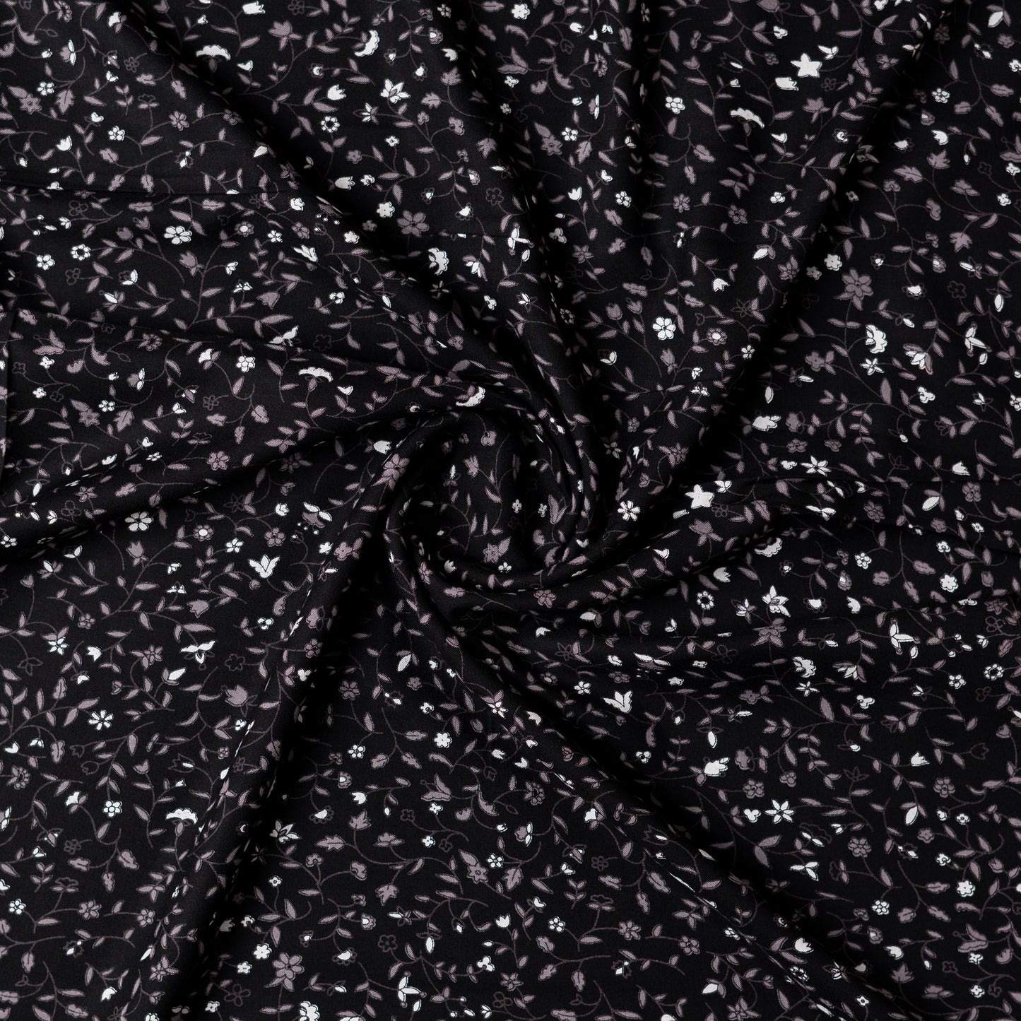 Black color rayon fabric with white and grey color floral prints, this is a small print elegant design.