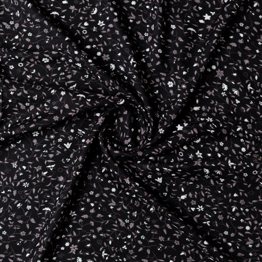 Black color rayon fabric with white and grey color floral prints, this is a small print elegant design.