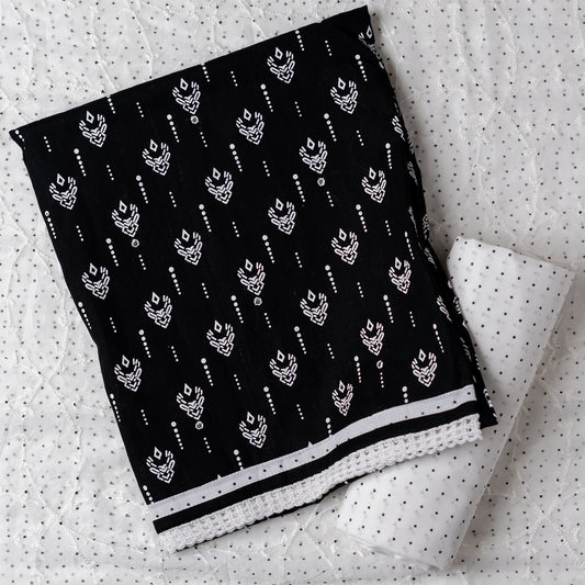 Cotton dress material with beautiful print design in white color on top, mirror work. It has white color lace on the borders. Chiffon dupatta with embroidery work in white color and black dotted prints. Cotton white color bottom with black dots.