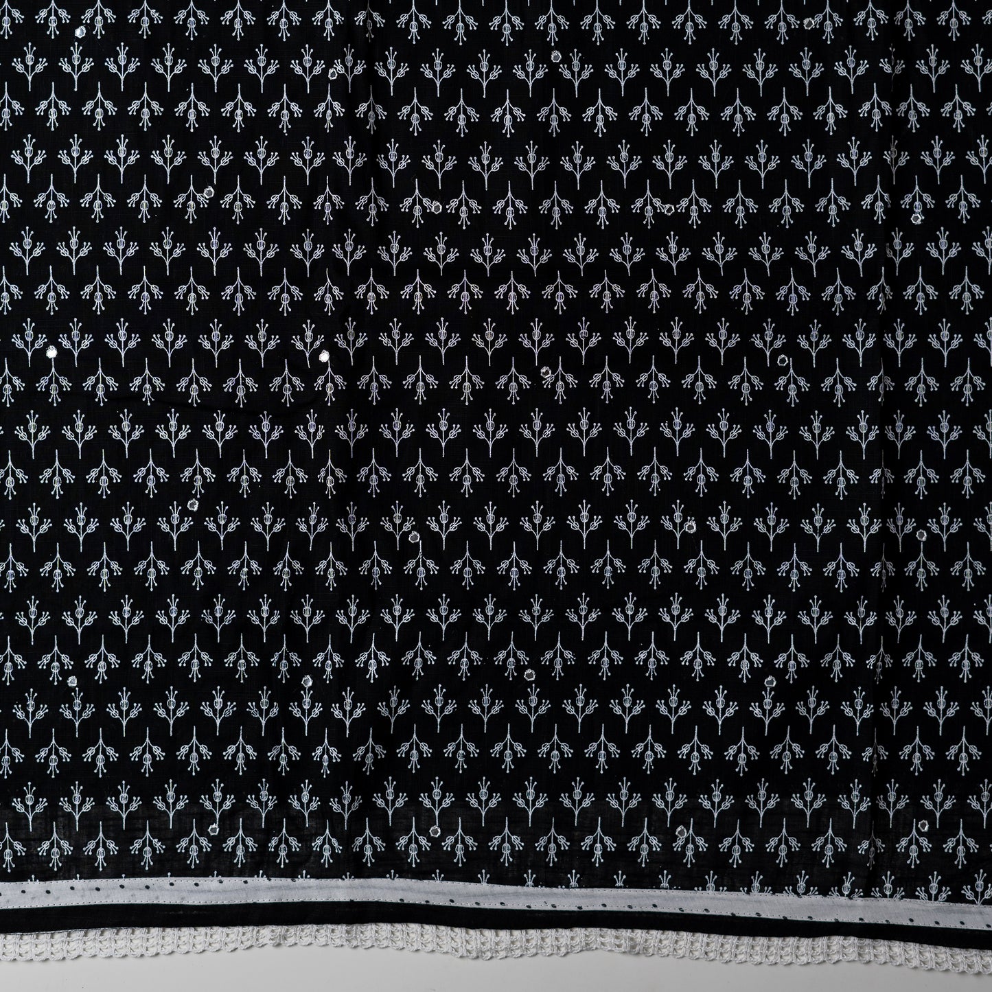 cotton black color top with white color print design and mirror work, it has lace work in the border