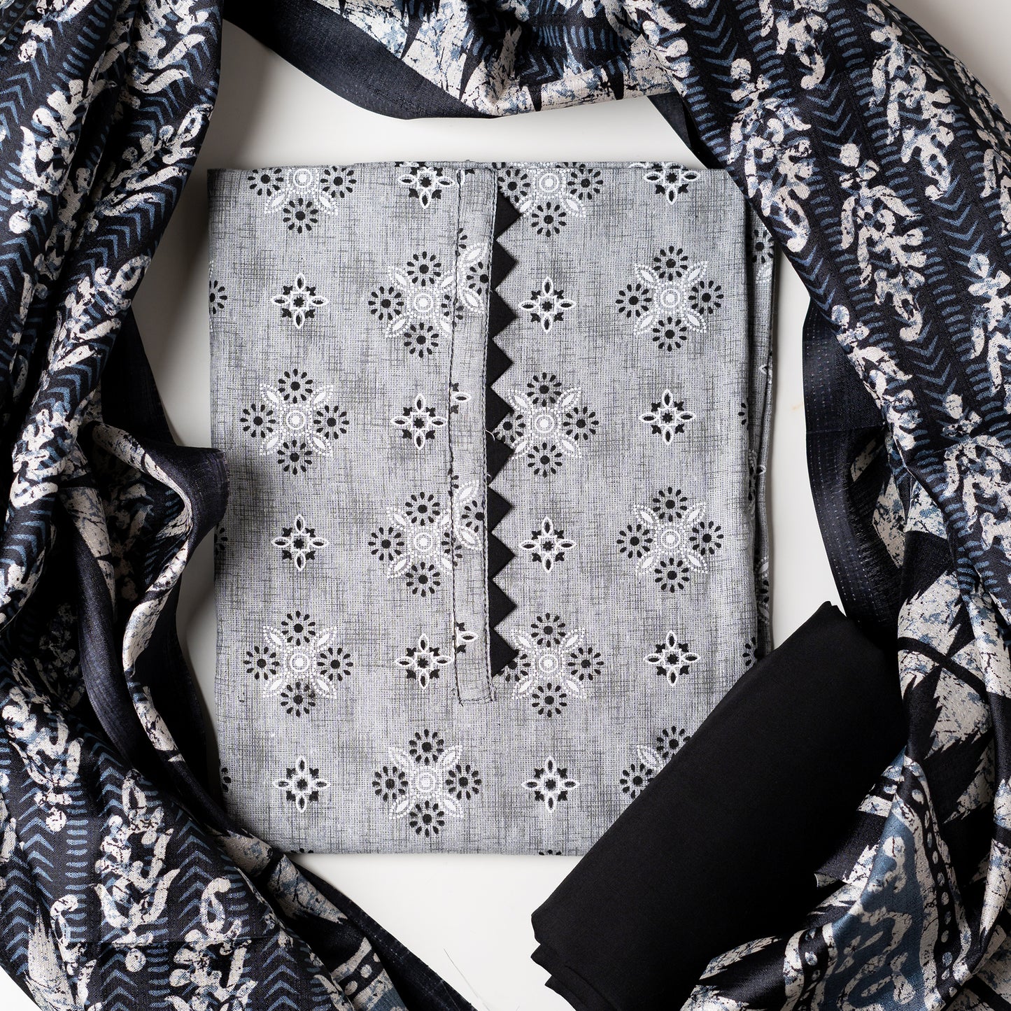 A must buy collection for upcoming summer season, cotton top with print design and pattern in neck line in black color. Chanderi printed dupatta, cotton plain black color bottom