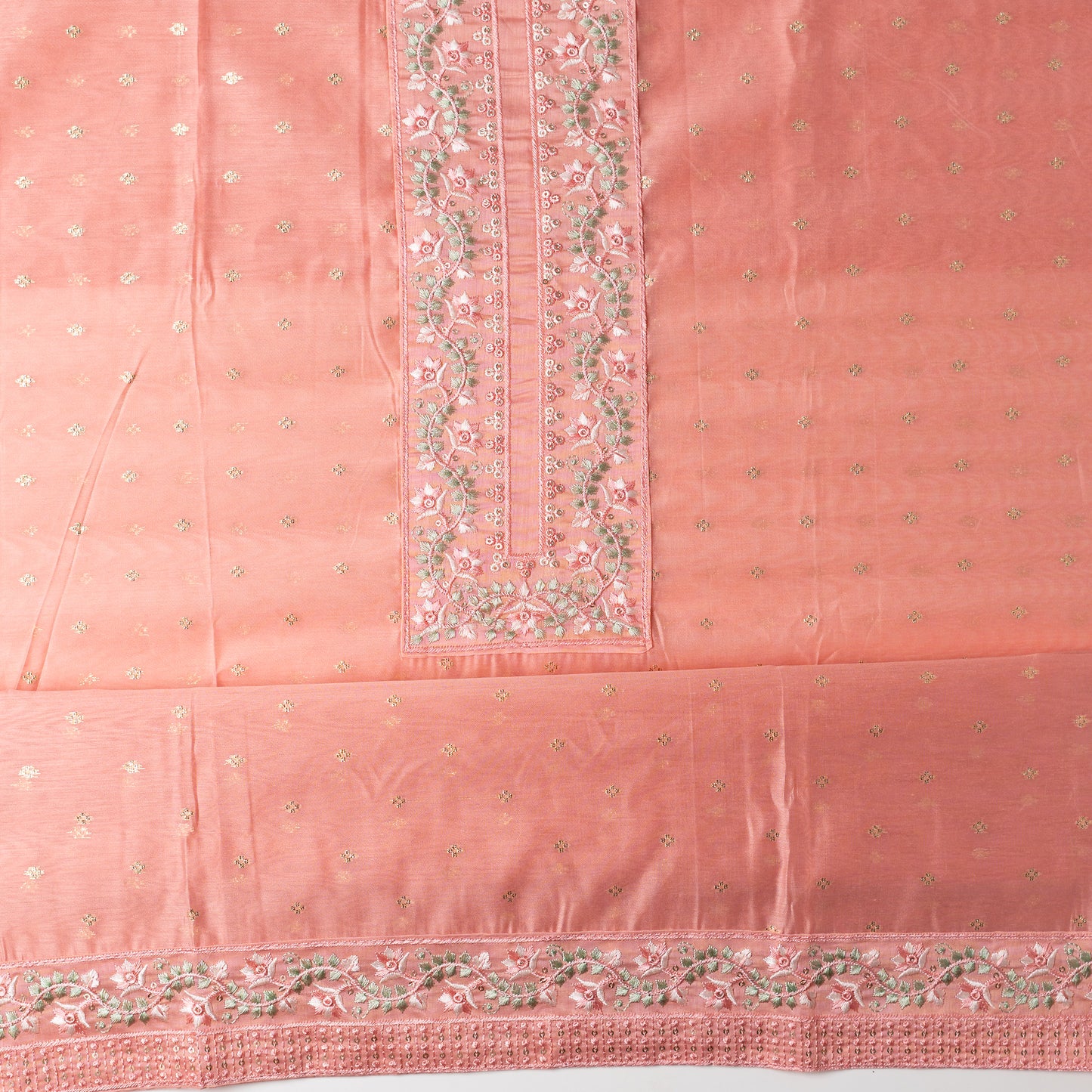 chanderi silk top with nicely crafted embroidery work in neck line, golden color jacquard weaving all over the body, embroidery work on the border of the dress matching the neck line, it has also golden color sequins work in the border