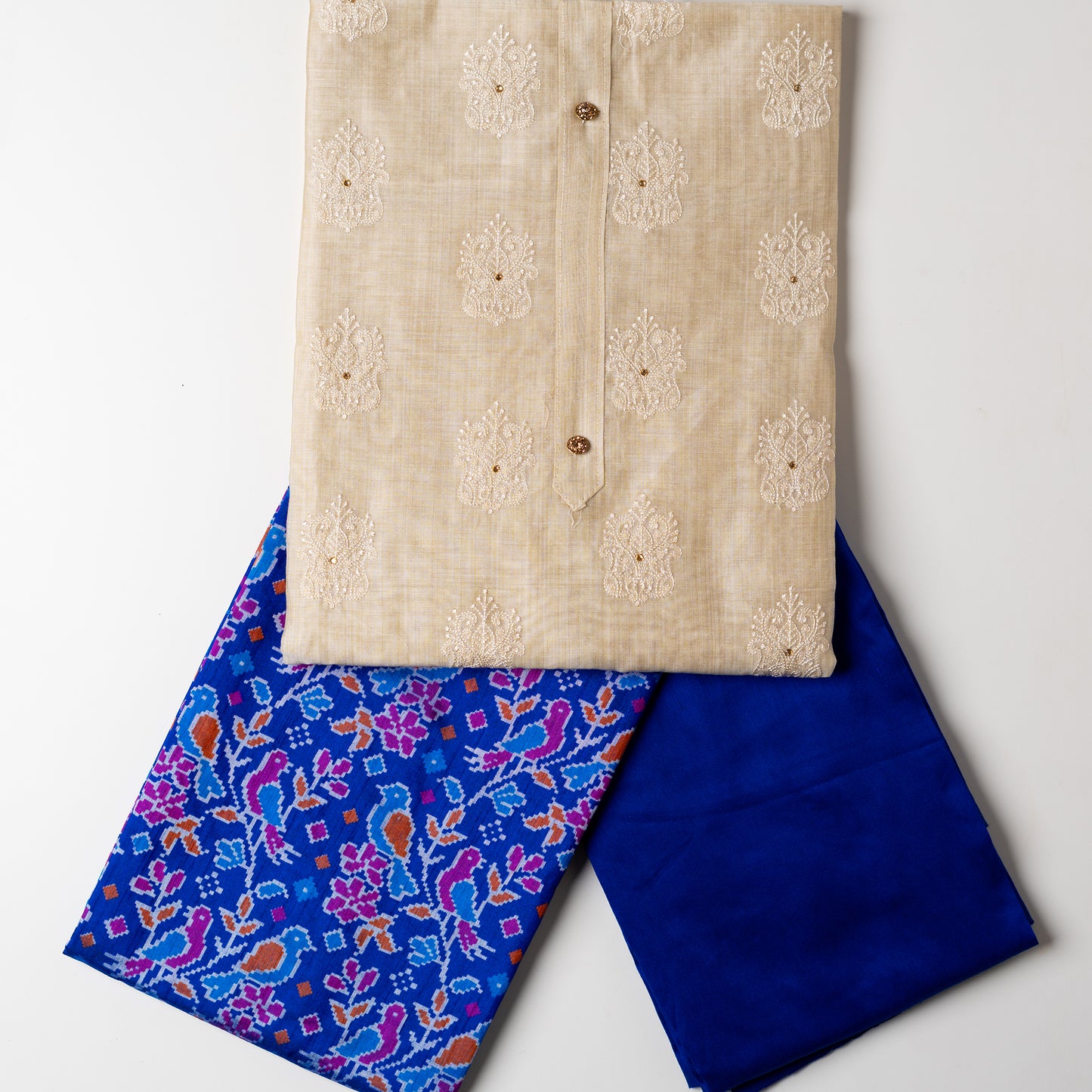 Chanderi silk dress material with embroidery and sequins work, the embroidery work is done with the same color thread of the top which gives a very elegant look. The top has show buttons, golden color piping in the border. Colorful digital printed silk dupatta , royal blue color cotton silk bottom
