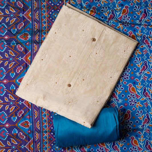 Chanderi silk dress material with embroidery and sequins work, the embroidery work is done with the same color thread of the top which gives a very elegant look. The top has show buttons and golden color piping in the border colorful digital printed silk dupatta , teal blue color cotton silk bottom.