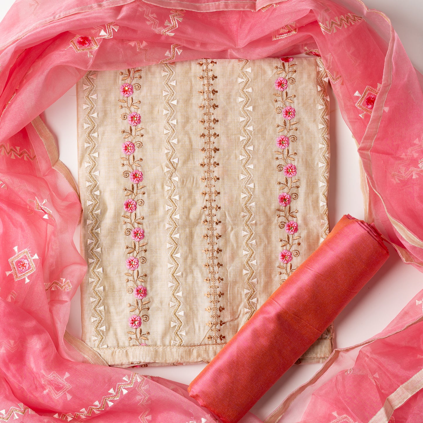 Unstitched Chanderi silk dress material with pink color embroidery work and zari thread work in between the embroidery. Cotton silk pink color bottom, Silk dupatta with embroidery work and zari thread work matching the top design