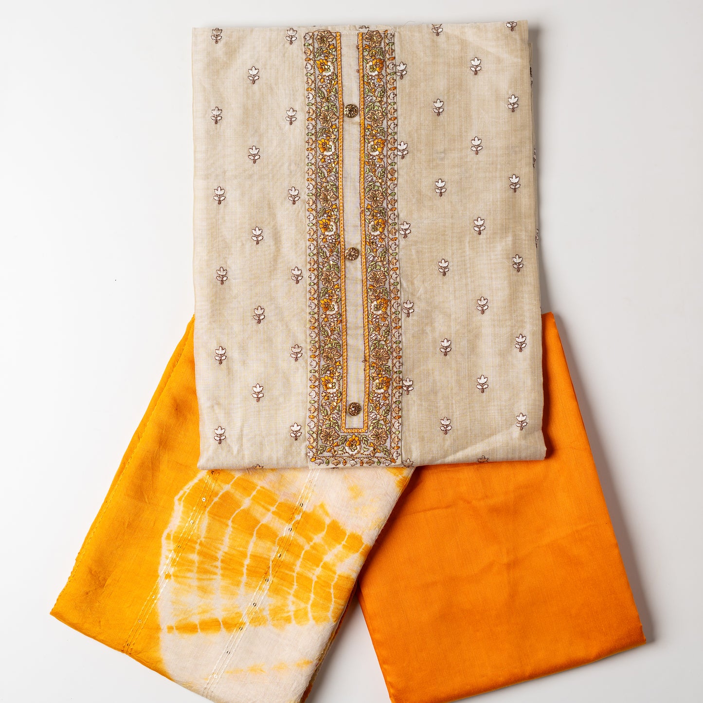 Chanderi Silk Dress material set, Ivory color Chanderi Silk top with floral embroidery all over the body in the front and elegant embroidery work in neck line with show buttons. cotton mustard color plain bottom. Mustard and cream color silk dupatta with sequins and thread work . perfect for gifting your mom or sister, can be used as party wear, office wear