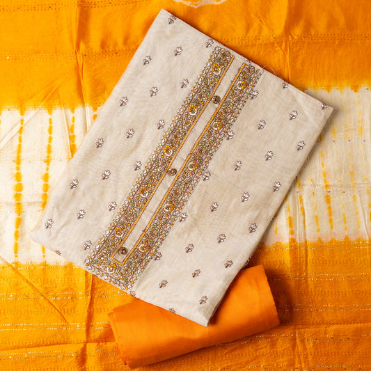 Chanderi Silk Dress material set, Ivory color Chanderi Silk top with floral embroidery all over the body in the front and elegant embroidery work in neck line with show buttons. cotton mustard color plain bottom. Mustard and cream color silk dupatta with sequins and thread work