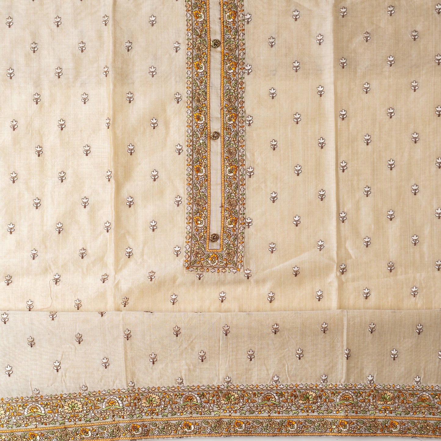 Ivory color Chanderi Silk top with floral embroidery all over the body in the front and elegant embroidery work in neck line with show buttons, it has embroidery work in the border also