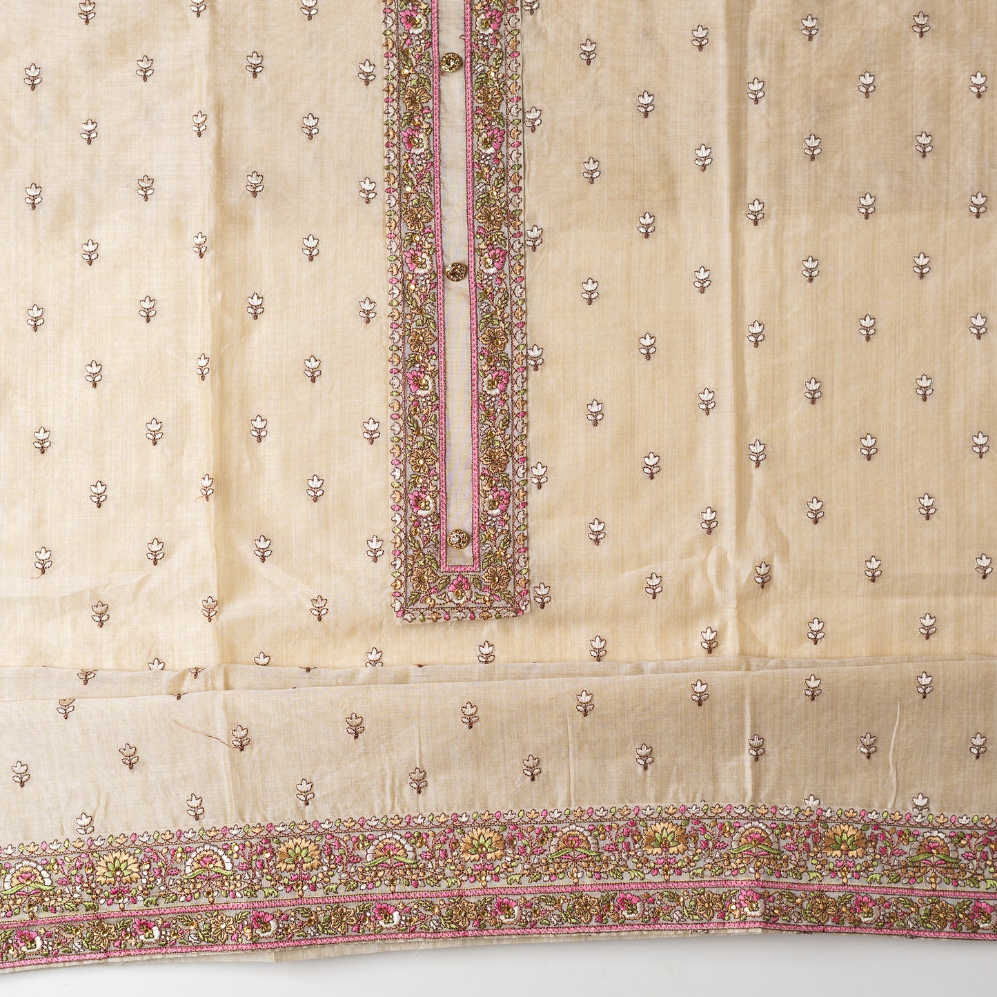Ivory color Chanderi Silk top with floral embroidery all over the body in the front and elegant embroidery work in neck line with show buttons, it has embroidery work in the border also