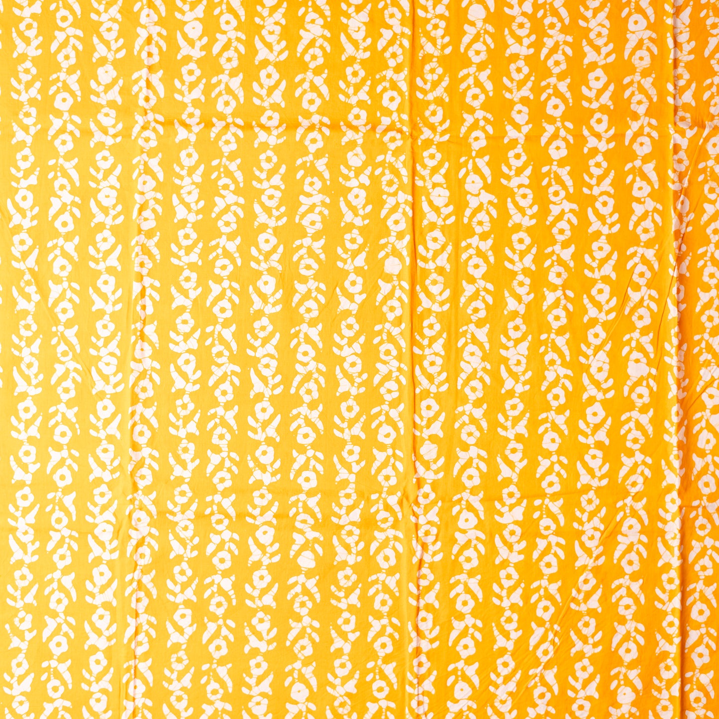 Yellow color cotton wax batik dress material with white prints