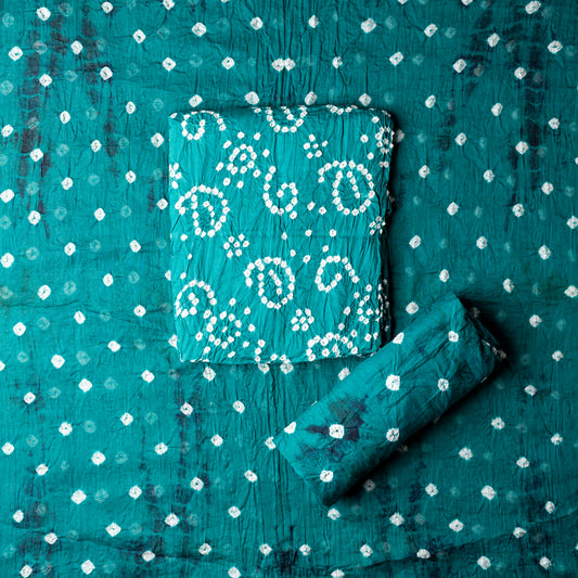 Teal Blue color top with white bandhej designs,  Teal blue color bottom with shibori designs in navy. Teal blue color dupatta with shibori designs in navy and golden borders.