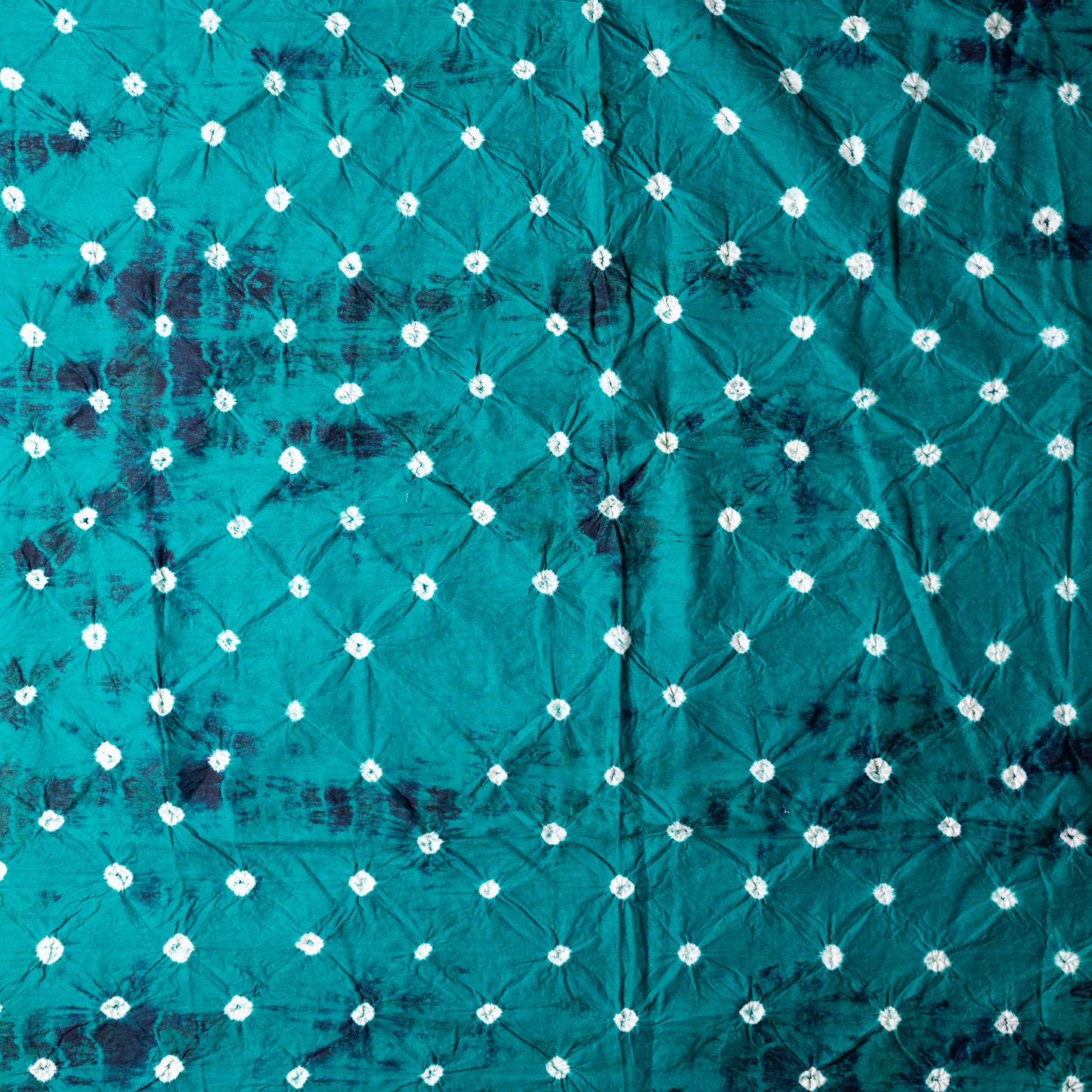 Teal blue color bottom with shibori designs in navy.