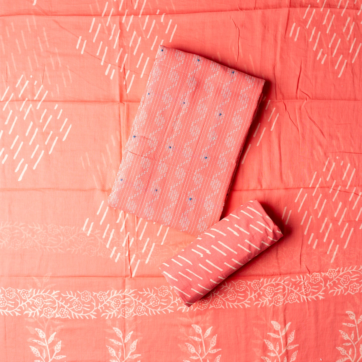 Cotton peach color top with katha work , cotton bottom with print design, mul cotton dupatta with matching print design.