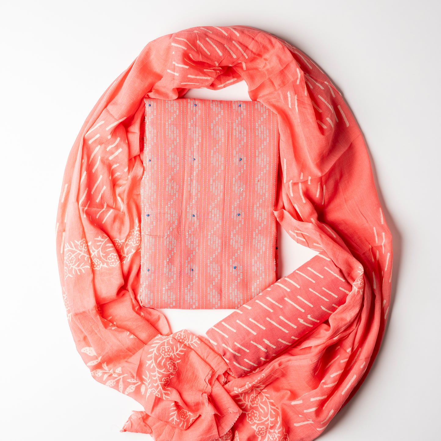 Cotton peach color top with katha work , cotton bottom with print design, mul cotton dupatta with matching print design.