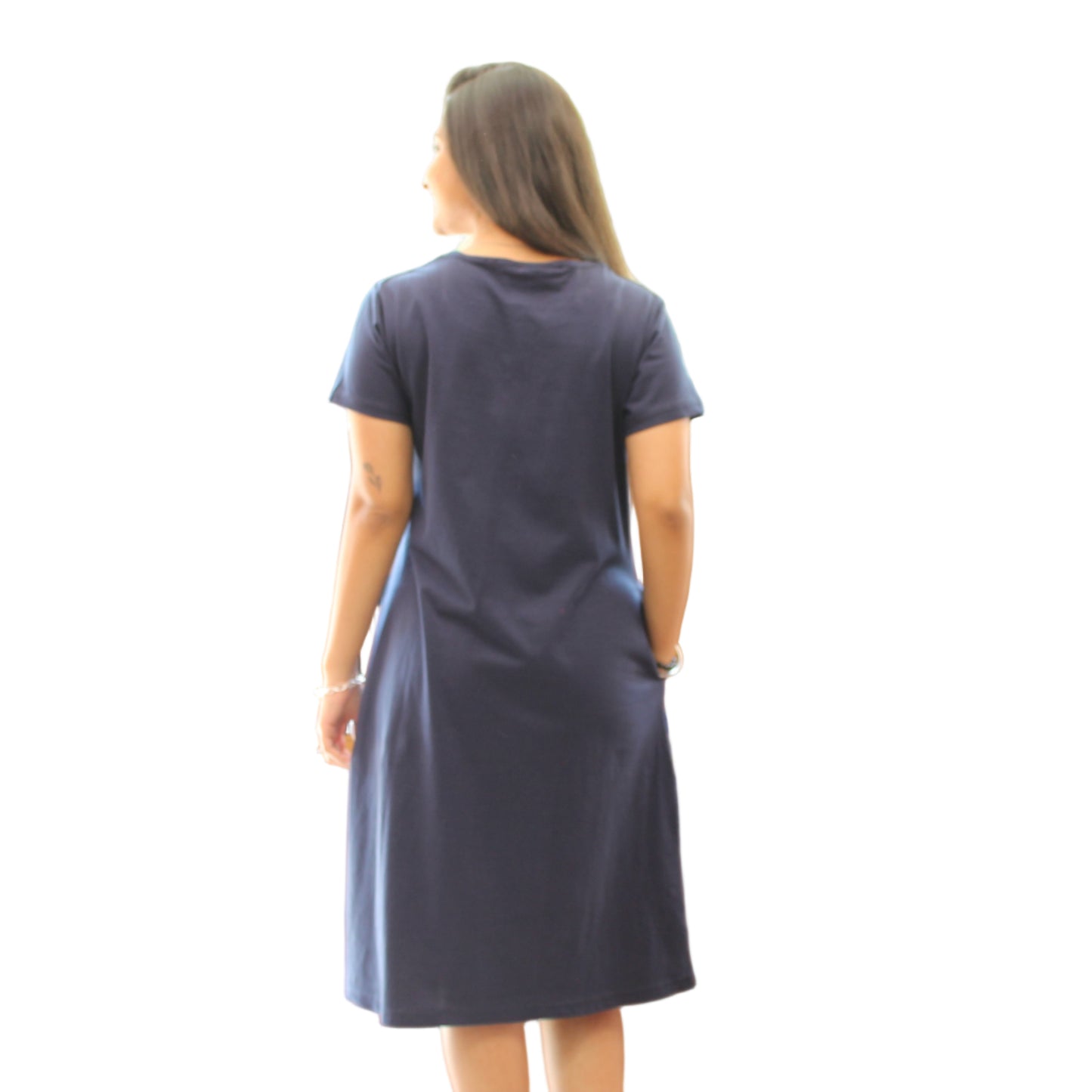 back view of women wearing navy blue t shirt dress with hands in pocket