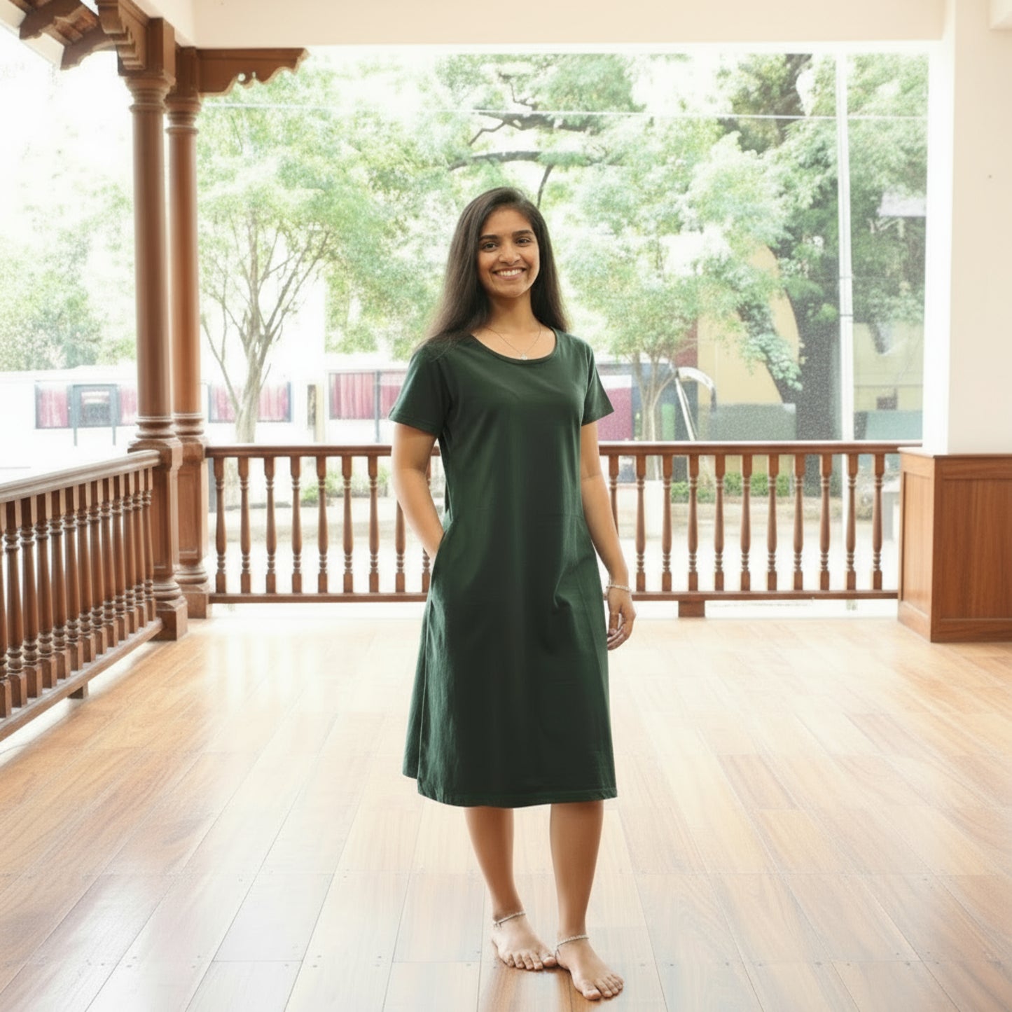 women wearing bottle green color t shirt dress with hands in pocket