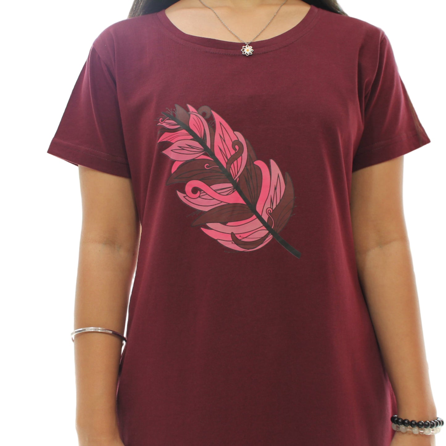 close up view of women wearing knee length dress, beautiful leaf design in the chest