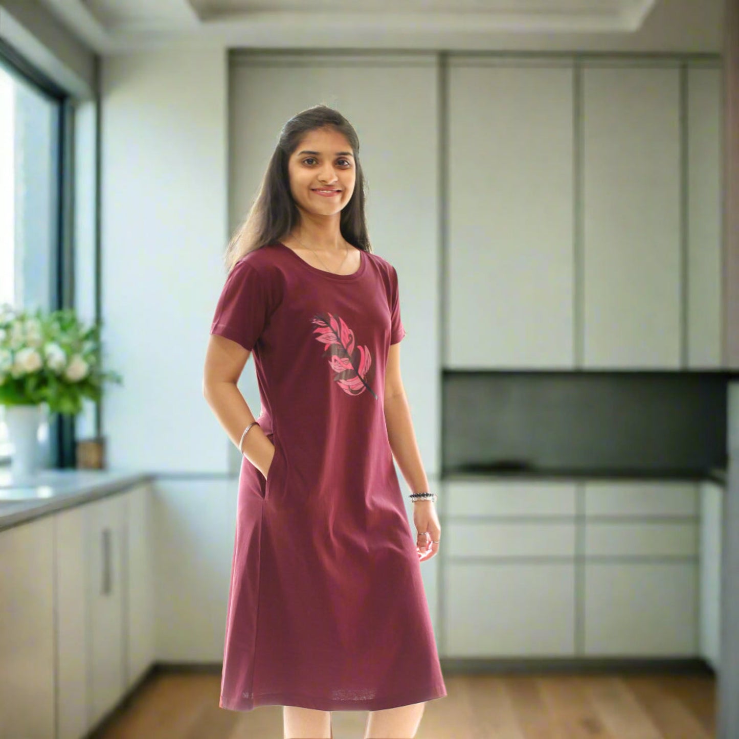 women wearing wine color knee length short nighty with leaf design in the chest area, putting hands in pocket.