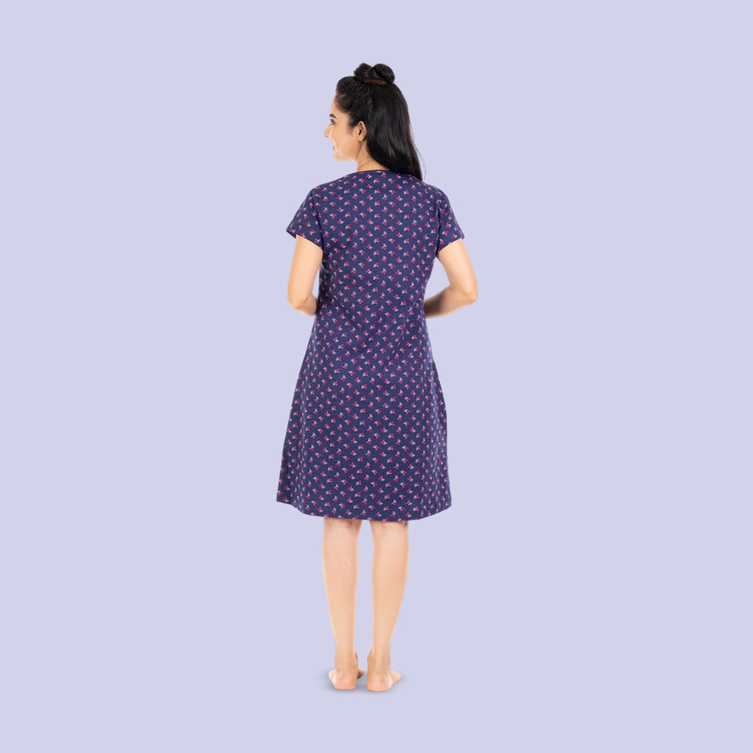 back side view of knee length t shirt dress in navy blue color