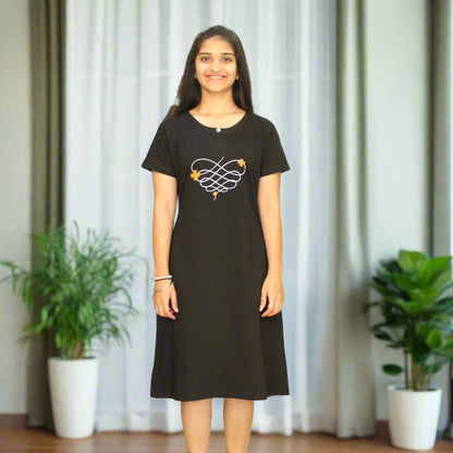 women wearing black cotton knee length short nighty with floral print on chest 