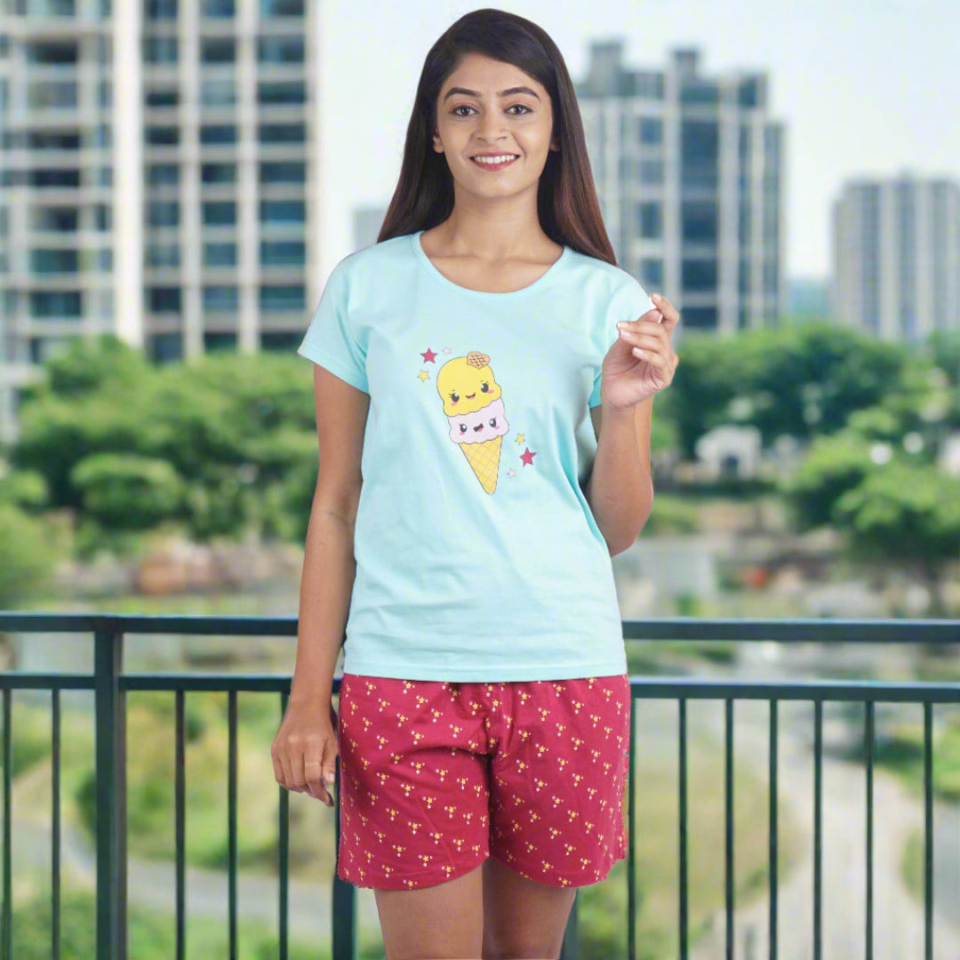light blue t shirt with print design on chest, maroon shorts with print design