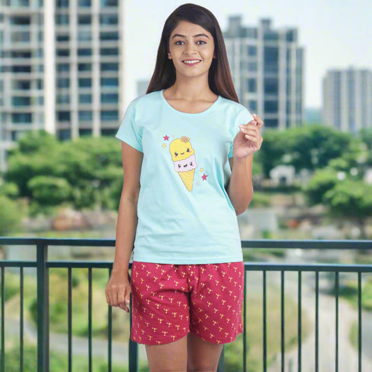 light blue t shirt with print design on chest, maroon shorts with print design