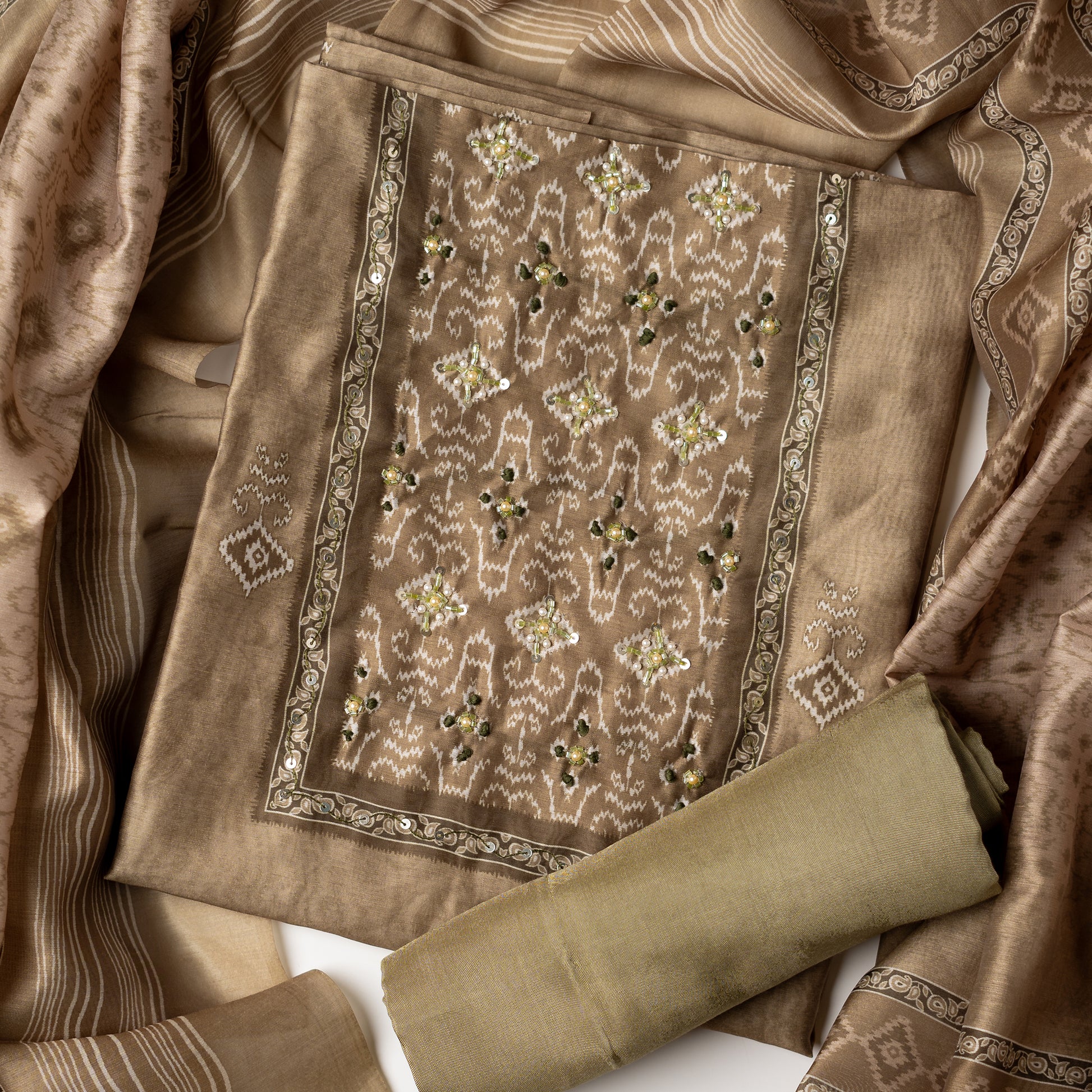 office wear green color unstitched churidar set with patola print and stone work