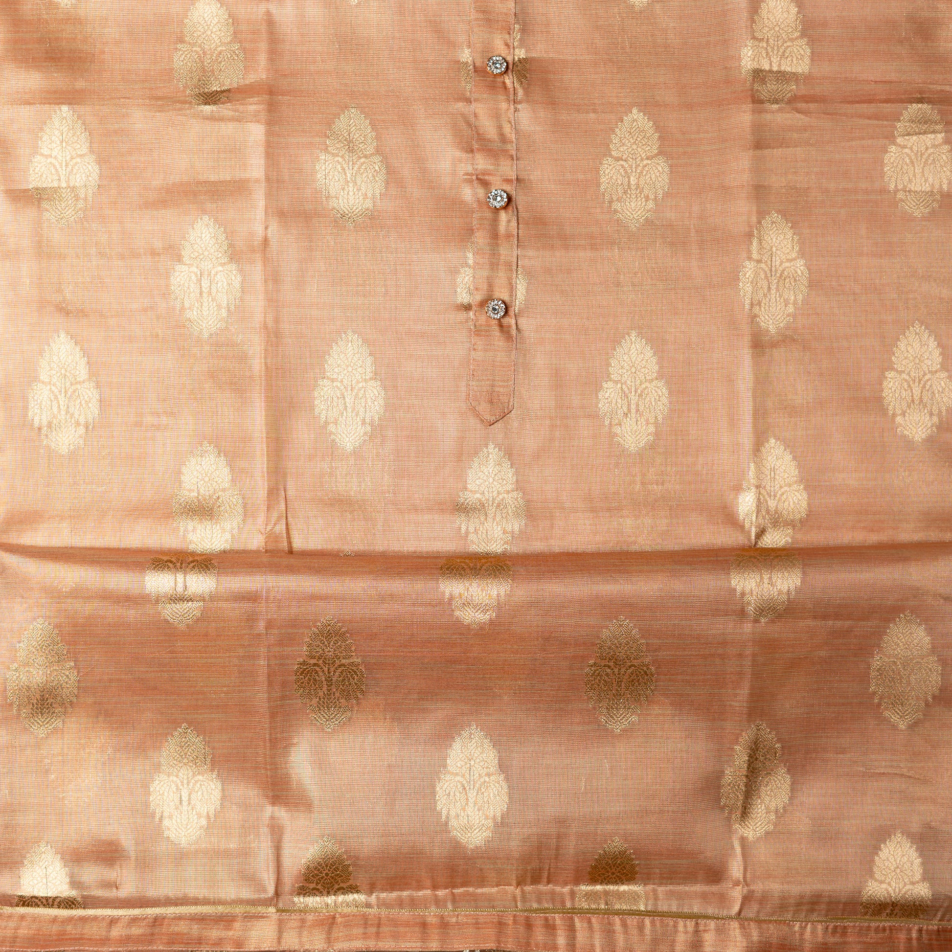 An elegantly crafted Tissue Silk Party wear dress material. A set best suited to gift bride to be or your loved on your anniversary. Tissue silk top with golden color embossed designs, it has show buttons in neck area, also golden color borders in side.