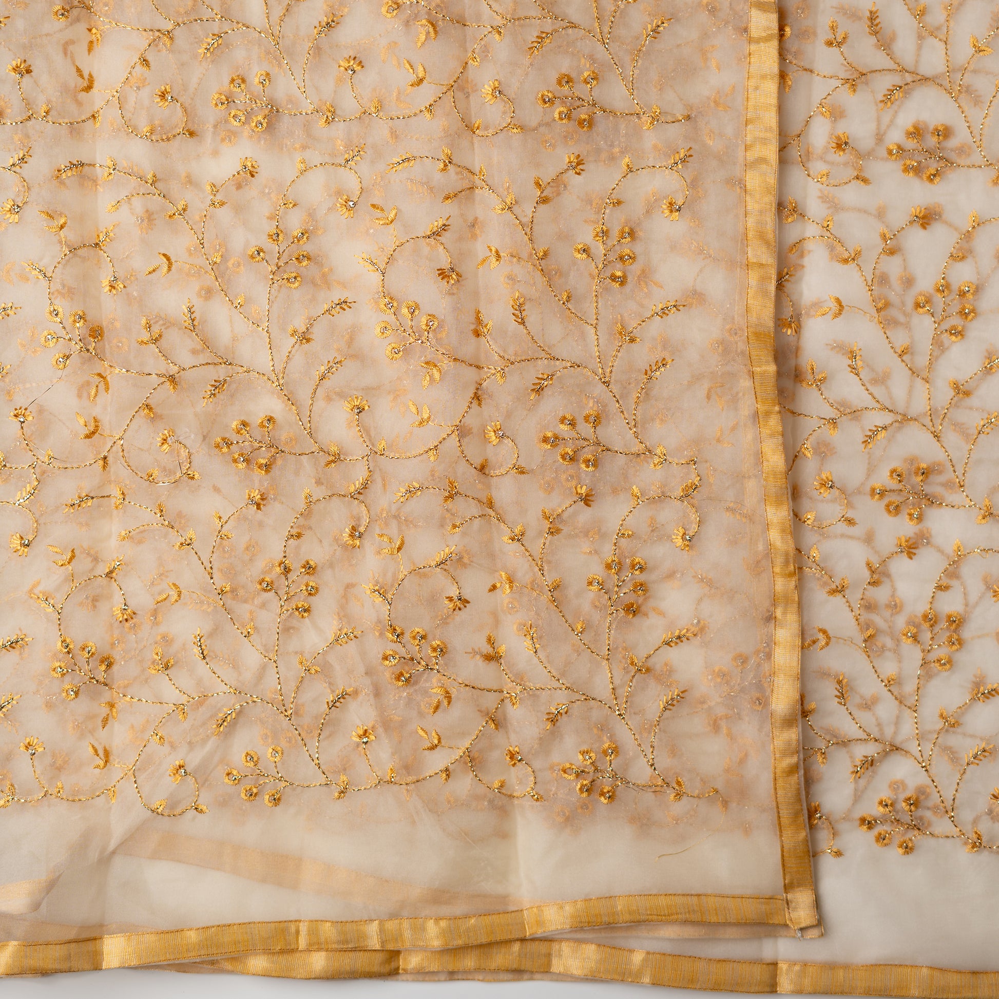 Silk dupatta with embroidery work with the same color thread of top and also golden color threads.