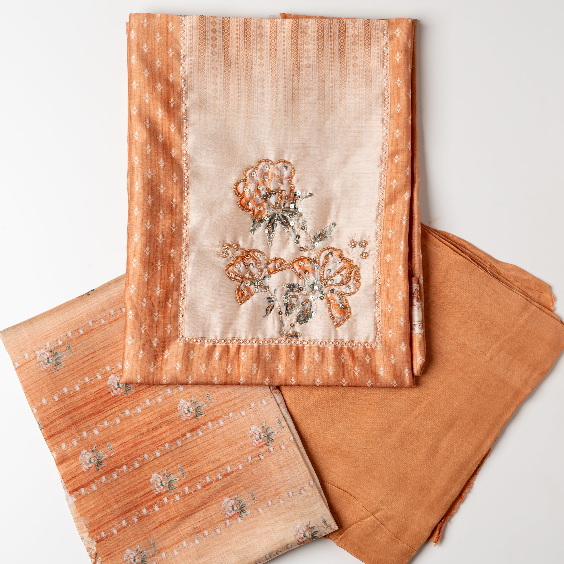 This beautiful chanderi silk unstitched salwar suit is perfect for any occasion, your office wear or party wear. Light orange color chanderi silk top with elegant digital prints all over the body. it has sequins and bead work in neck line area. Cream color dupatta with digital print designs. Cotton silk light orange color bottom .