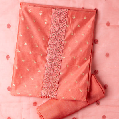 peach color Beautiful chanderi silk dress material with embroidery and sequins work on neck line. It has jacquard weaving in golden threads all over the top. Tissue silk dupatta with elegant embroidery and sequins work all over dupatta and at the borders. Peach color cotton silk bottom  matching the top and dupatta.
