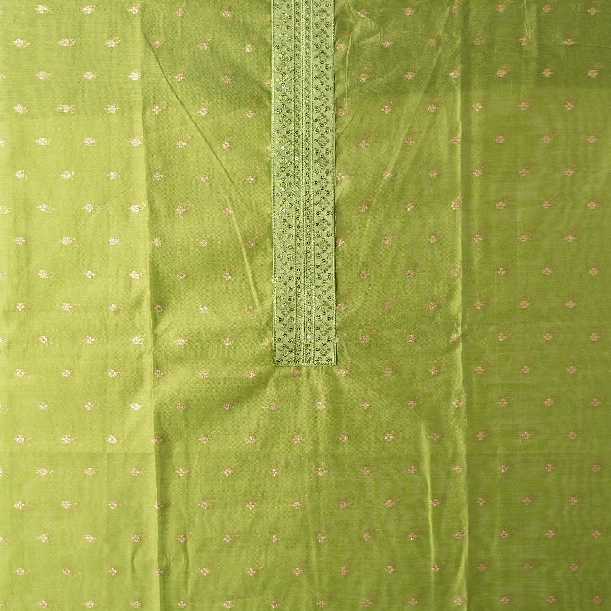Beautiful chanderi silk dress material with embroidery and sequins work on neck line. It has jacquard weaving in golden threads all over the top.