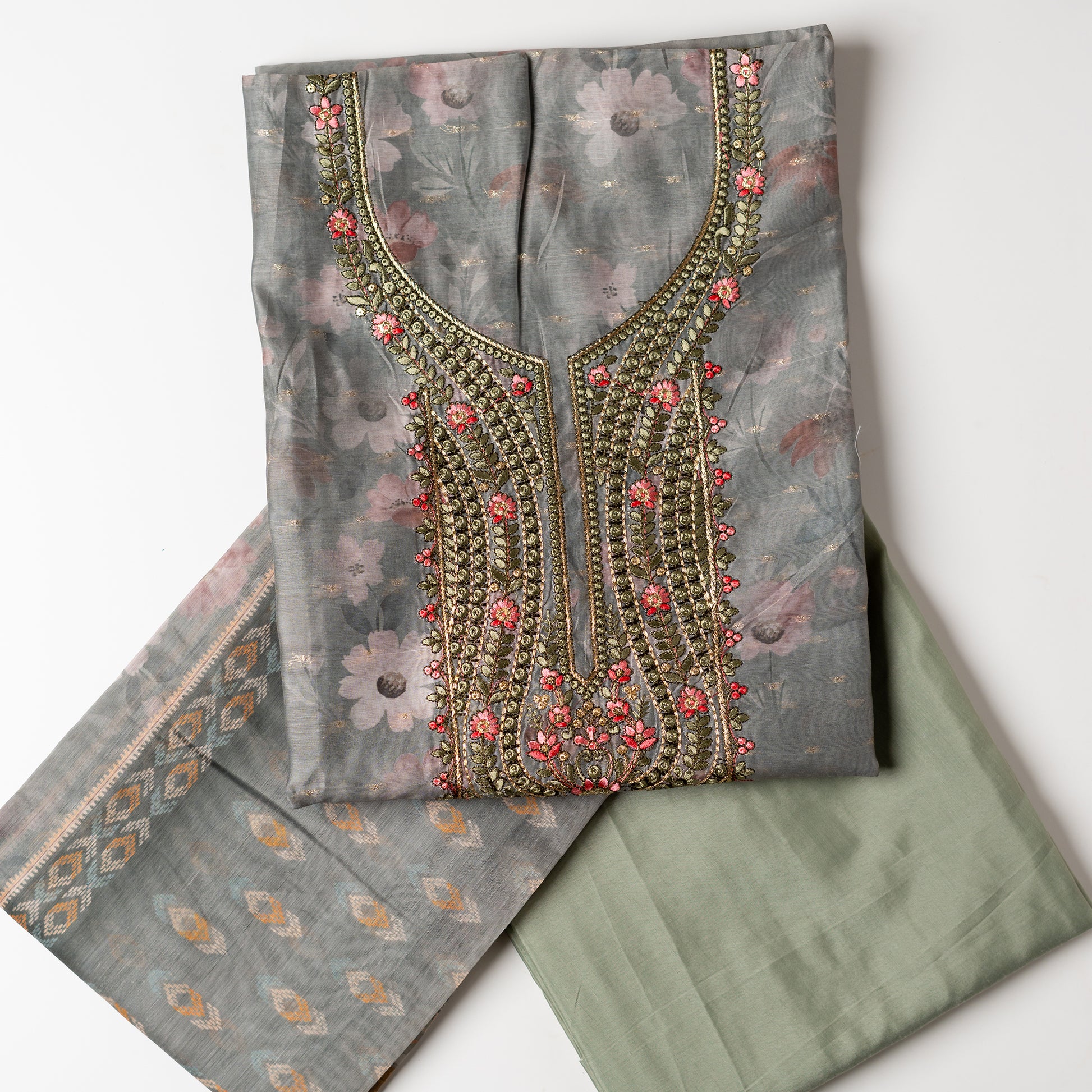 It's just awesome, pick any color of this design and we are sure you will love it the most. Beautiful embroidery work  in the neck. Sober floral prints and jacquard weaving in golden thread is giving the set a royal look. Silk dupatta with exact same design as the top with golden color border. Pastel green color bottom matching exactly as the top and dupatta.