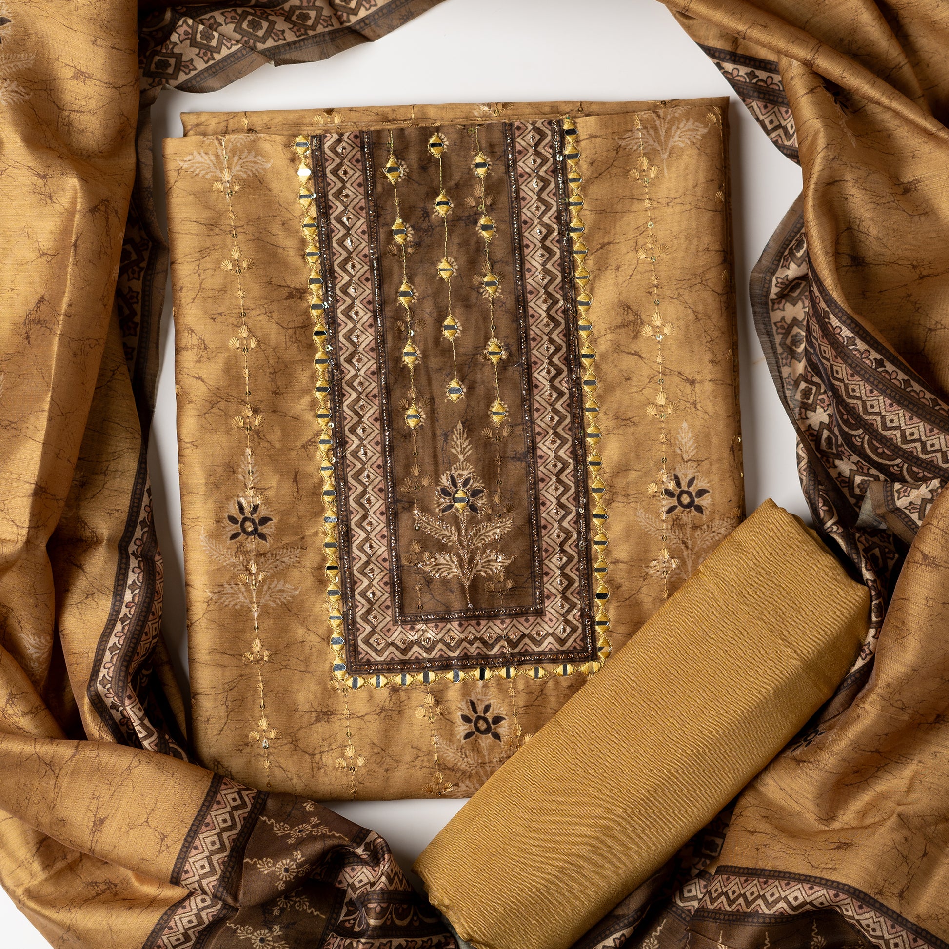 Chanderi silk dress material with print design, embroidery work, thread work and sequins work. It has zari and mirror work in neck area also. Silk dupatta with beautiful digital prints matching the top color. Cotton silk bottom same color as the top and dupatta.